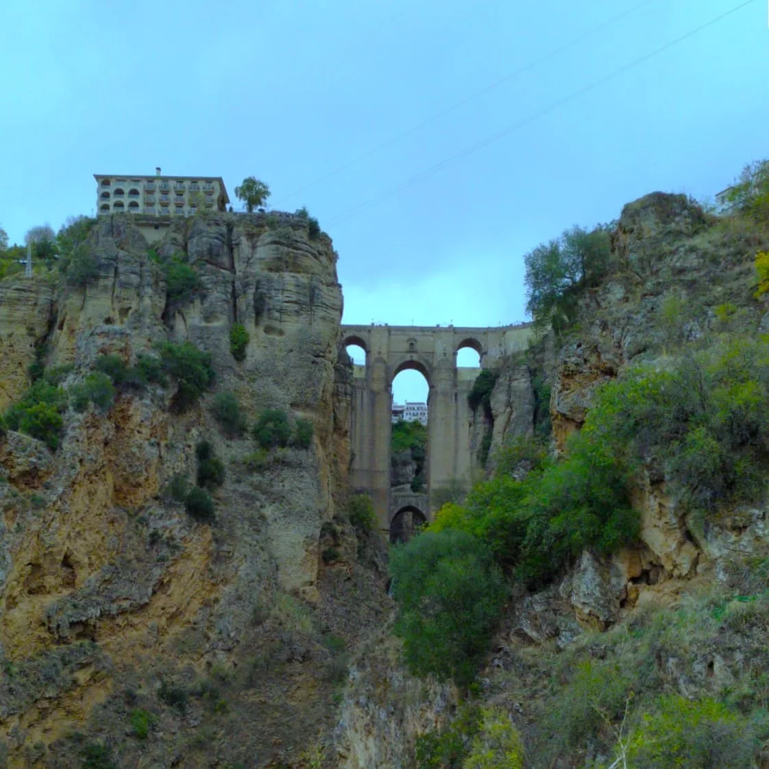 Puente Nuevo bridge spanning the El Tajo gorge in Ronda, seen from below on a day trip from Seville